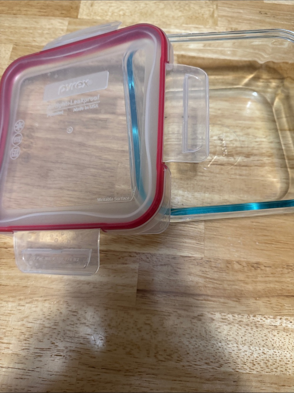 Pyrex Glass Storage Container with Red Seal and Blue-Tinted Glass